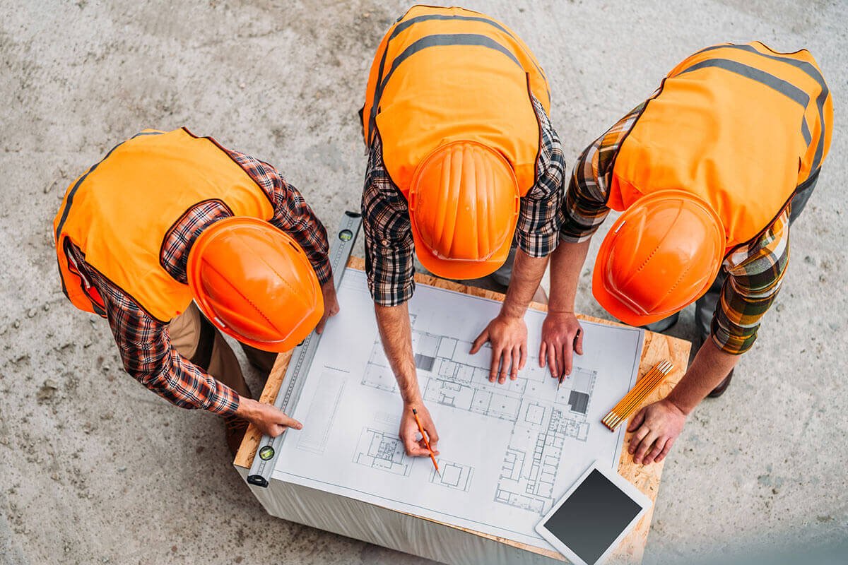 high-angle-view-of-group-of-builders-discussing-bu.jpg