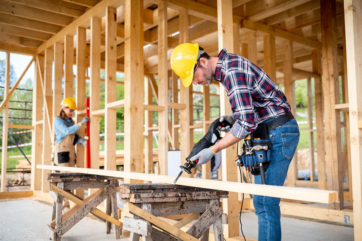 team-of-workers-doing-woodwork-at-construction-sit.jpg